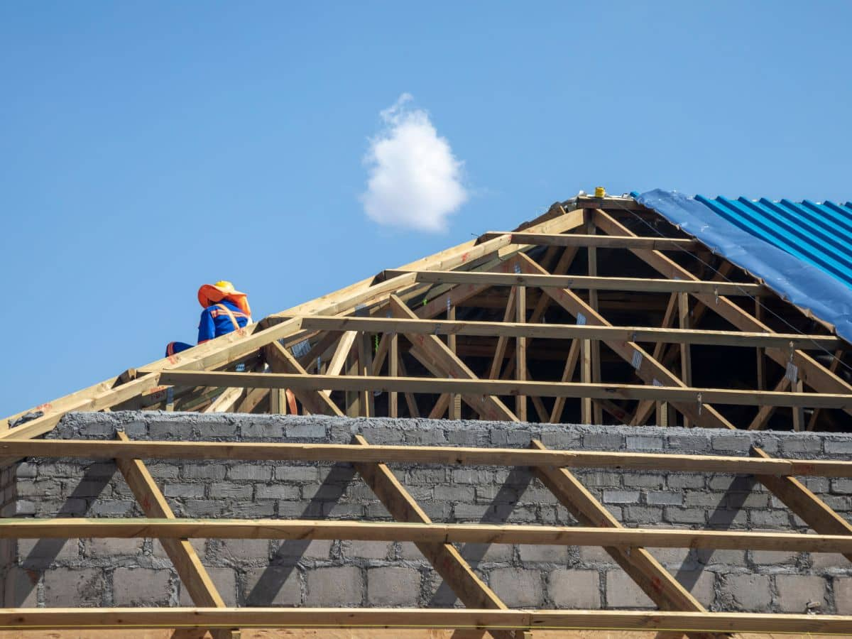 man with drill working on roof renewal