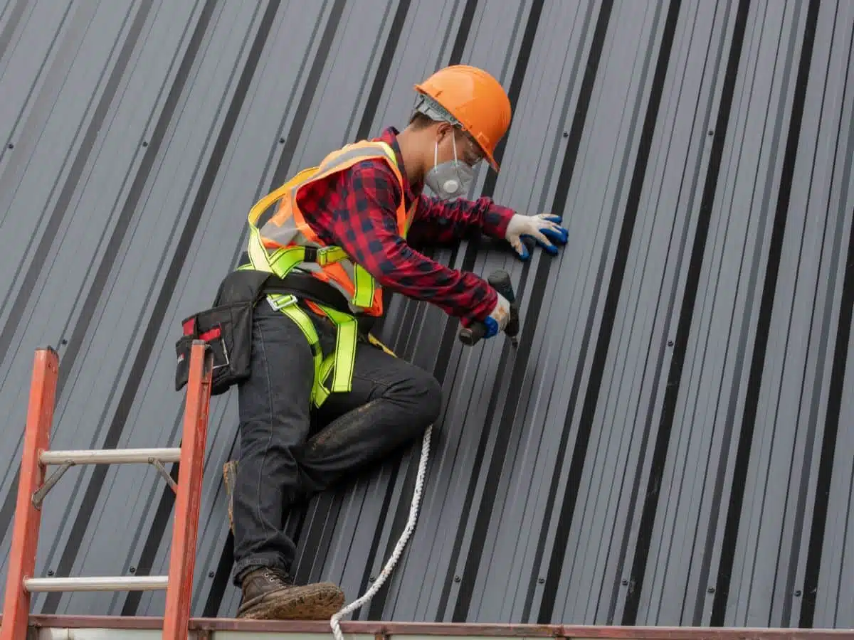 two roofers working on roof replacement 