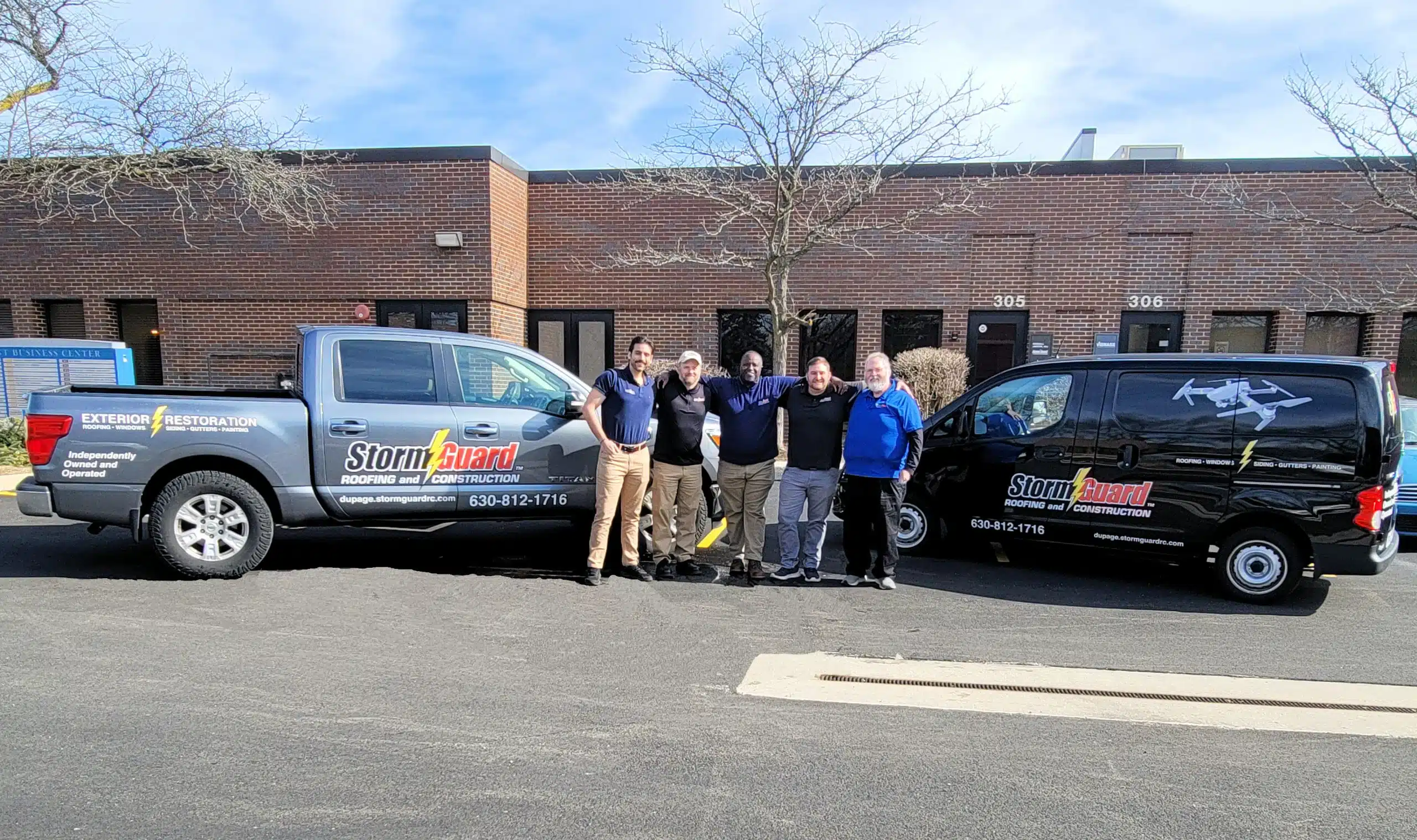 Brick House with Storm Guard Restoration Services Truck In Driveway